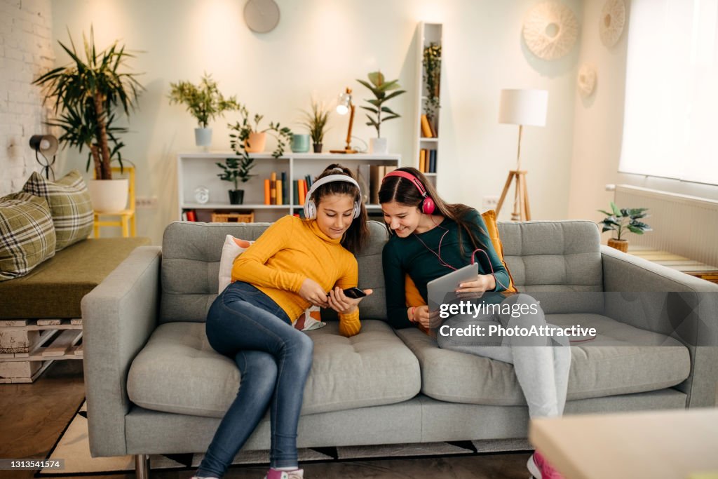 Lappable Fun They Have Fun With The Phone And The Tablet High-Res Stock Photo ...