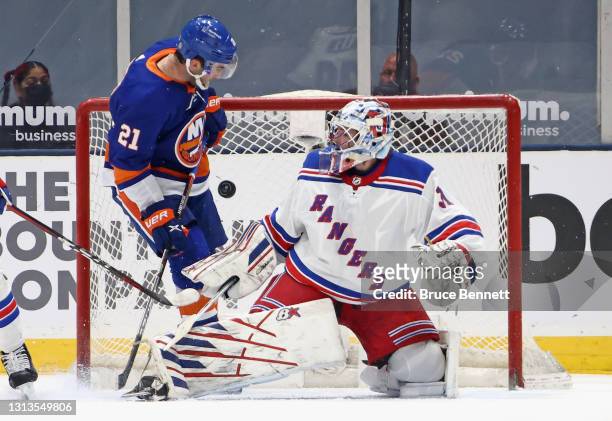 Kyle Palmieri of the New York Islanders is stopped by Igor Shesterkin of the New York Rangers during the first period at the Nassau Coliseum on April...