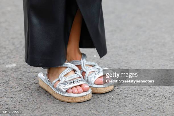 Silver chunky ugly dad sandals by Chanel as a detail of Influencer Gitta Banko during a street style shooting on April 20, 2021 in Duesseldorf,...