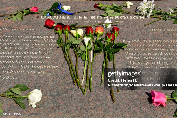 The family of Daniel "u201cDanny"u201d Rohrbough placed roses next to his name at the Columbine Memorial at Robert F. Clement Park on April 20, 2021...