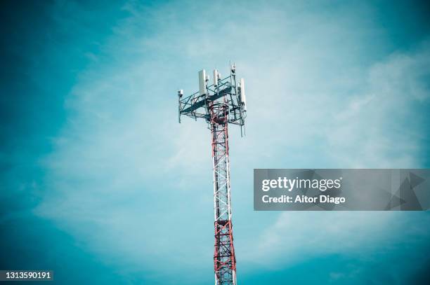 artistic photo of a mobile phone antenna. - cb funk stock-fotos und bilder