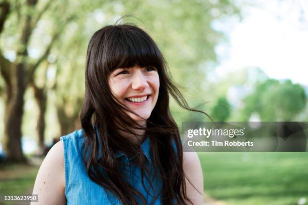 woman laughing off camera - suburban lifestyles stock pictures, royalty-free photos & images