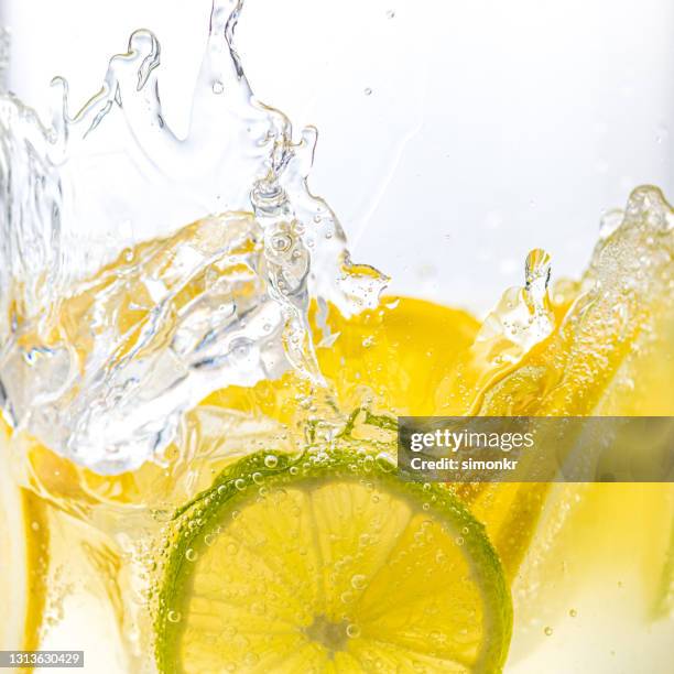 gin and tonic with lemon and lime - gin tonic stock pictures, royalty-free photos & images