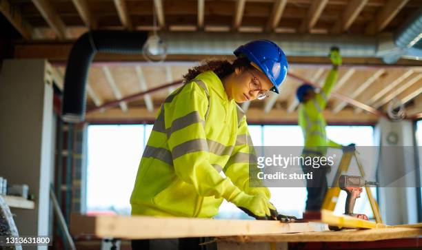 female construction trainee - wood working stock pictures, royalty-free photos & images
