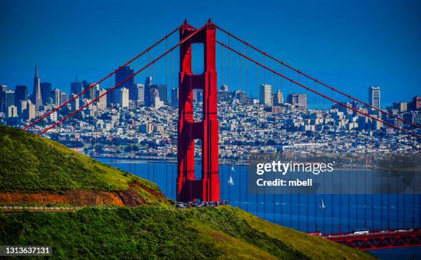 view of city skyline through the golden gate bridge from marin highlands - san francisco ca - golden gate park stock-fotos und bilder