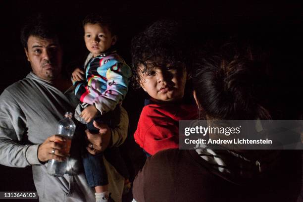 Refugee families from Central America, many with small children, cross the Rio Grande River from Mexico into the United States, on April 15, 2021 in...