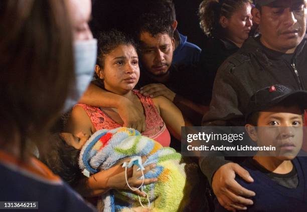 Refugee families from Central America, many with small children, cross the Rio Grande River from Mexico into the United States, on April 15, 2021 in...