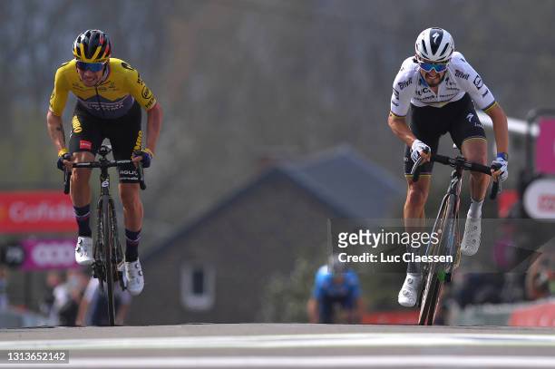 Primoz Roglic of Slovenia and Team Jumbo - Visma & Julian Alaphilippe of France and Team Deceuninck - Quick-Step sprint on arrival during the 85th La...