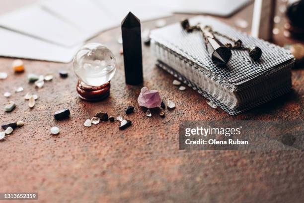 various gems and balls on a black bag with space - carte tarot photos et images de collection