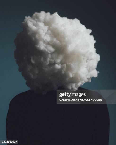 close-up portrait of a man in a studio with cotton covering face representing a cloud,paris,france - covering eyes stock pictures, royalty-free photos & images