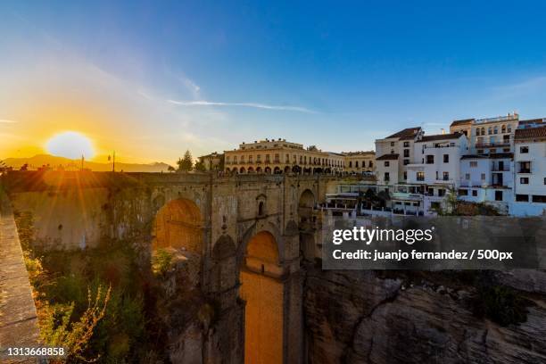 view of buildings against sky during sunset,ronda,spain - renda stock-fotos und bilder