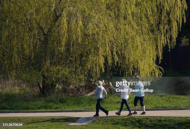 Elderly women walk at a fast pace in a park during the third wave of the coronavirus pandemic on April 20, 2021 in Berlin, Germany. Outdoor exercise...