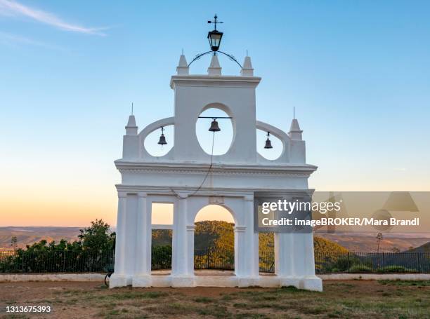 bell tower of the chapel ermita reina de los angeles, at sunset, alajar, huelva, spain - provincia de huelva stock pictures, royalty-free photos & images