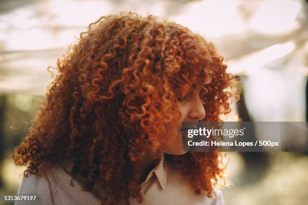 woman of color with red curly hair in a dreamy forest,belo horizonte,state of minas gerais,brazil - to editorial use stock pictures, royalty-free photos & images