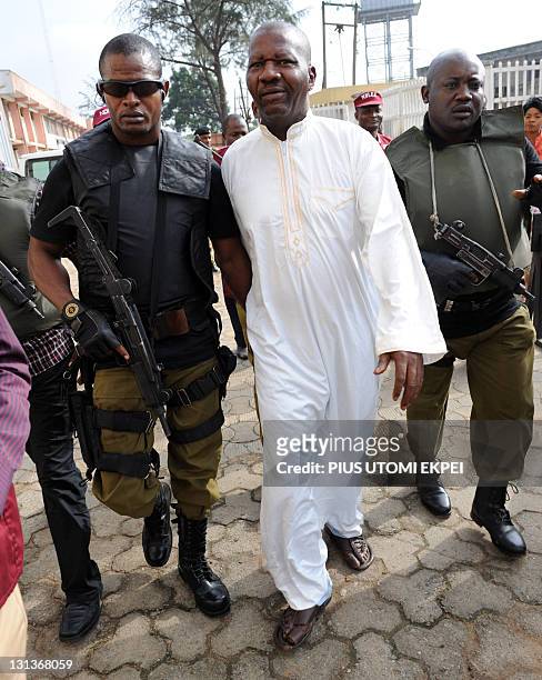 Leading Nigeria comic actor Babatunde Omidina, known by the stage name as Baba Suwe, accompanied by armed security operatives is lead to courtroom...