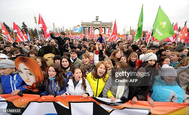 Activists of the pro-Kremlin youth movement "Nashi" carry their flags as they rally in front of the VVts All Russian Exhibition Centre, formerly...