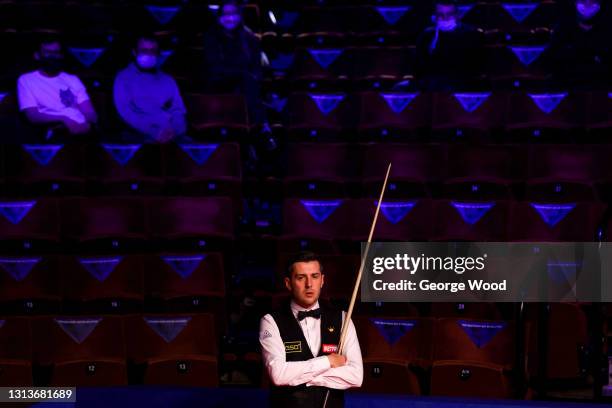 Mark Selby of England looks on during the Betfred World Snooker Championship Round One match between Kurt Mafin of Norway and Mark Selby of England...