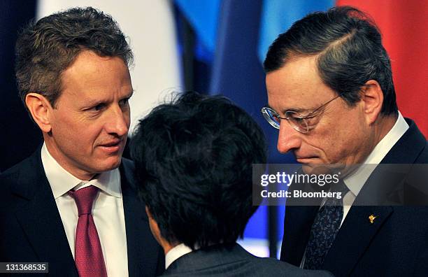 Timothy Geithner, U.S. Treasury secretary, left, speaks with Jun Azumi, Japan's finance minister, center, and Mario Draghi, president of the European...