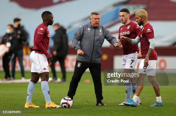 Craig Shakespeare, Coach of Aston Villa interacts with John McGinn and Douglas Luiz prior to the Premier League match between Aston Villa and...