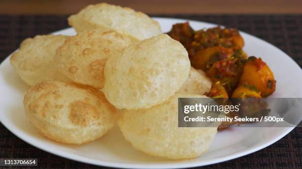 close-up of food in plate on table,kolkata,west bengal,india - west bengal fotografías e imágenes de stock