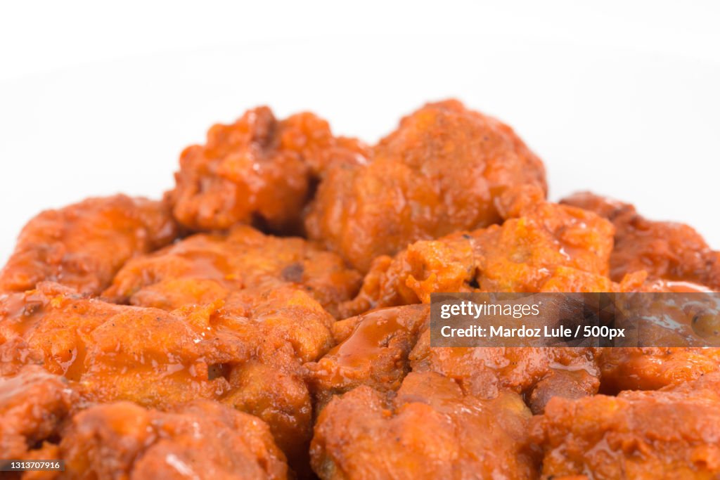 Close-up of fried chicken against white background