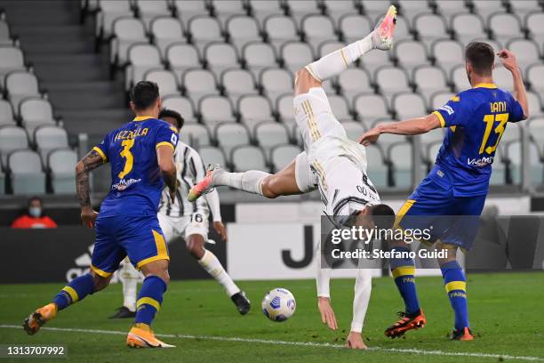 Cristiano Ronaldo of Juventus FC suffers a foul during the Serie A match between Juventus and Parma Calcio at on April 21, 2021 in Turin, Italy.