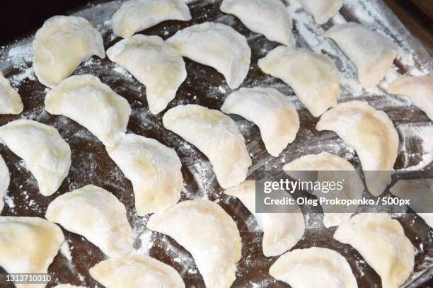 high angle view of dumplings in cooking pan - oleg prokopenko bildbanksfoton och bilder