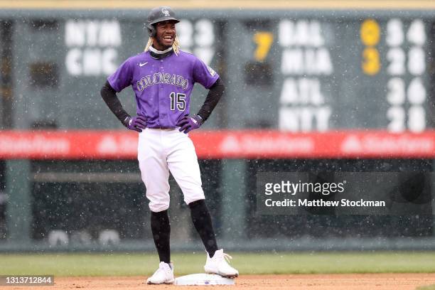Snow falls as Raimel Tapia of the Colorado Rockies stands on second base after hitting a double against the Houston Astros in the first inning at...