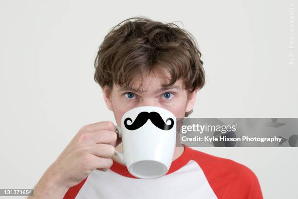 man drinking coffee - bigote manillar fotografías e imágenes de stock