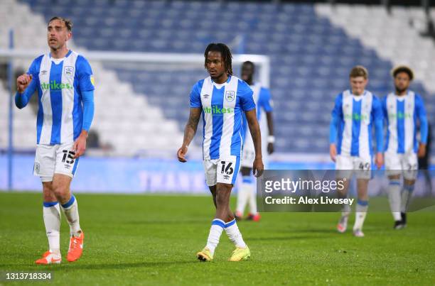 Rolando Aarons of Huddersfield Town along with team mates looks dejected after the Sky Bet Championship match between Huddersfield Town and Barnsley...