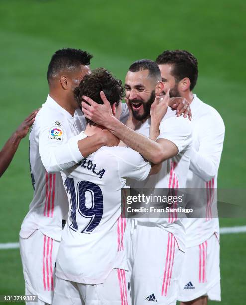 Alvaro Odriozola of Real Madrid celebrates scoring a goal with team mates during the La Liga Santander match between Cadiz CF and Real Madrid at...