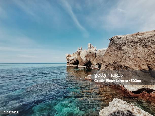 scenic view of sea against sky - gozo stock-fotos und bilder