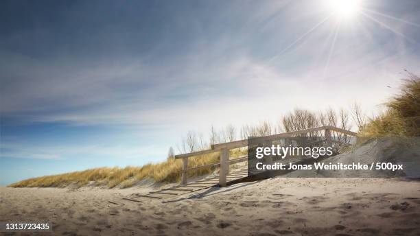 scenic view of snow covered land against sky,heiligenhafen,germany - jonas weinitschke stock pictures, royalty-free photos & images