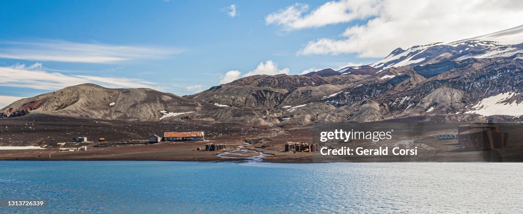 Whaler's Bay in Deception Island, Antarctica. A volcanic caldera with ruins of a Bristish Antartic Survery base and a Norwegian whaling operation. Both destroyed by 1969-70 volcanic eruption.