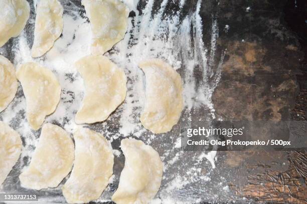 high angle view of dough on table - oleg prokopenko stock pictures, royalty-free photos & images