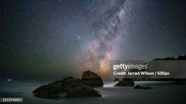 scenic view of sea against sky at night,new zealand - new zealand night stock pictures, royalty-free photos & images