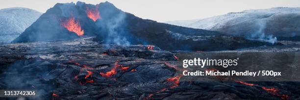 scenic view of volcanic crater against sky,iceland - lava stock pictures, royalty-free photos & images