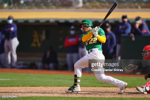 Ramon Laureano of the Oakland Athletics drives in a run by reaching first on an error during the tenth inning against the Minnesota Twins at...