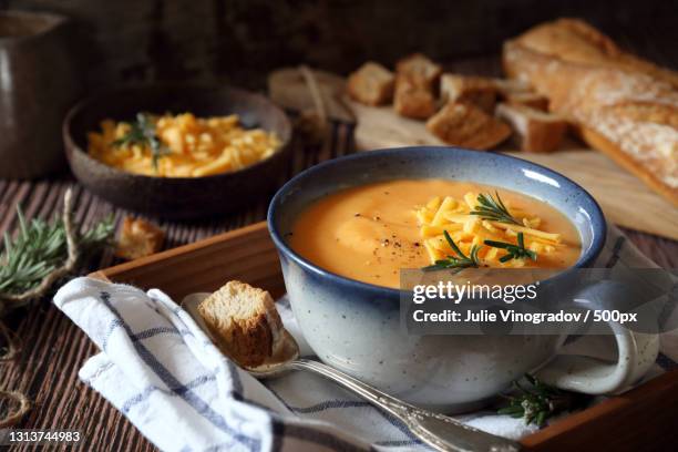 high angle view of soup in bowl on table - velouté stockfoto's en -beelden