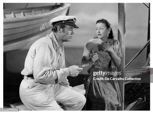 Actor Fred MacMurray as 'Captain Boll' and Czech Actress and Figure Skater Vera Ralston as 'Kim Kim' in a scene from the movie 'Fair Wind to Java'...