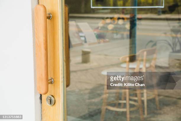 outside looking in cafe shop interior bar counter corner - escaparate fotografías e imágenes de stock
