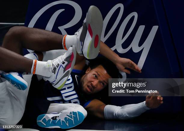 Jalen Brunson of the Dallas Mavericks reacts after being fouled by Isaiah Stewart of the Detroit Pistons in the third quarter at American Airlines...