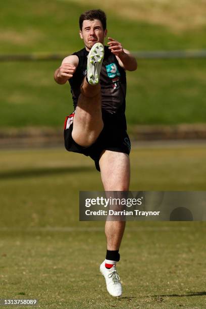 Jack Higgins kicks the ball during a St Kilda Saints AFL training session at RSEA Park on April 22, 2021 in Melbourne, Australia.