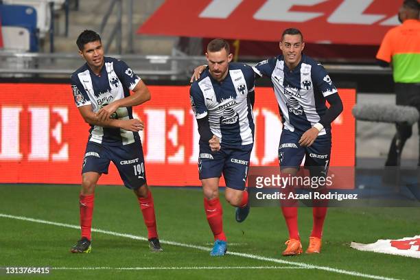 Vincent Janssen of Monterrey celebrates with teammates Rogelio Funes Mori and Luis Sánchez after scoring his team's first goal during the 12th round...