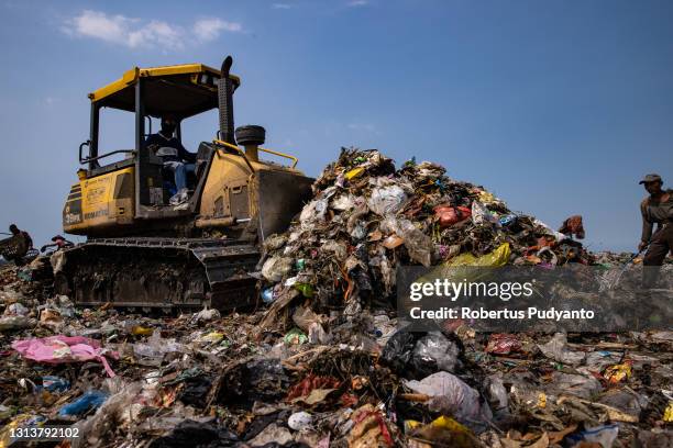 Bulldozer flatten waste at Jabon landfill on April 22, 2021 in Sidoarjo, East Java, Indonesia. The Indonesian Government has through the Ministry of...