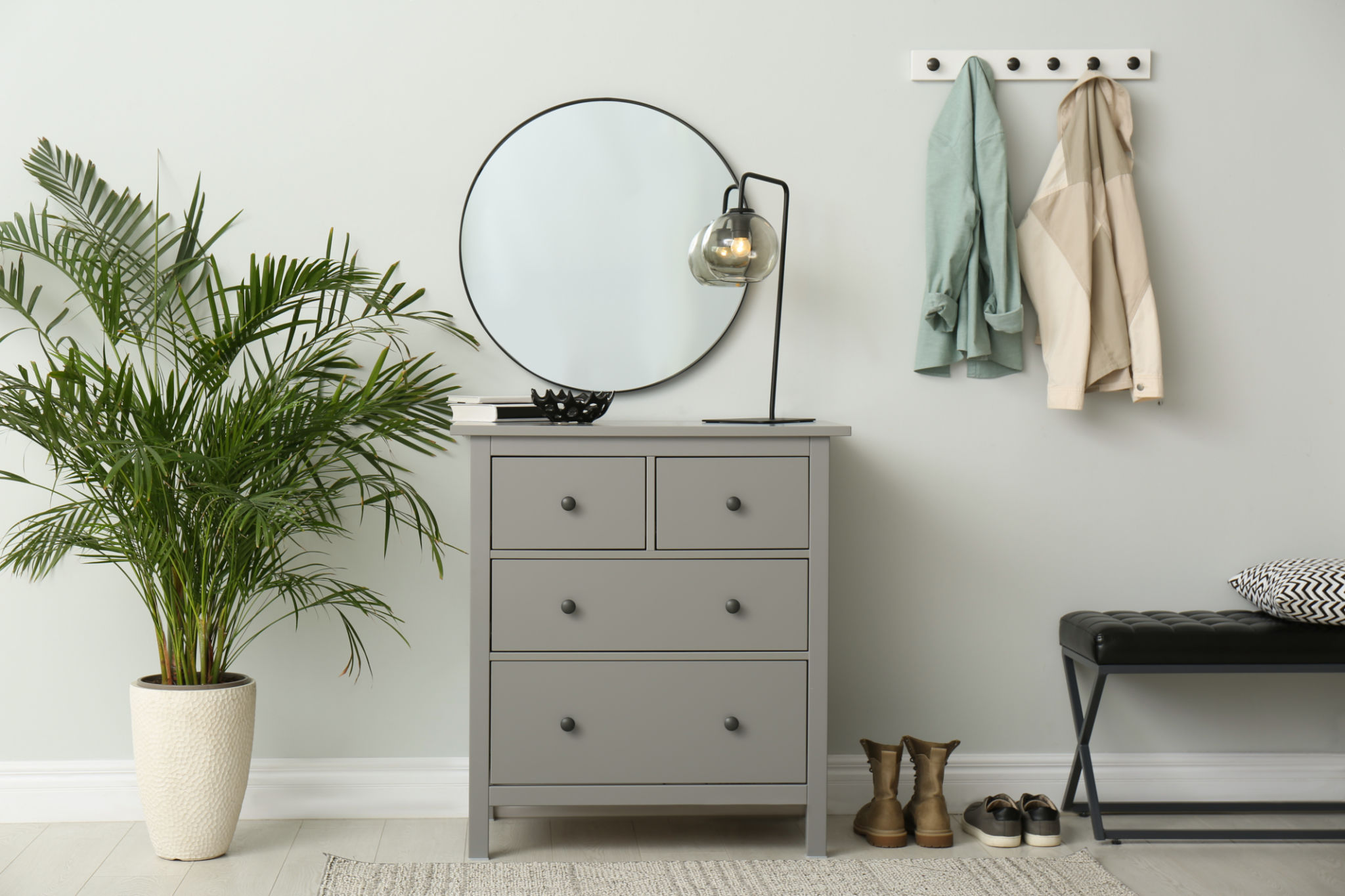 Modern hallway with stylish furniture, clothes and accessories. Interior design Modern hallway with stylish furniture, clothes and accessories. Interior design