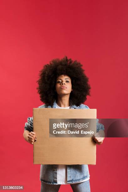 afro woman holding a placard - red revolution stock pictures, royalty-free photos & images