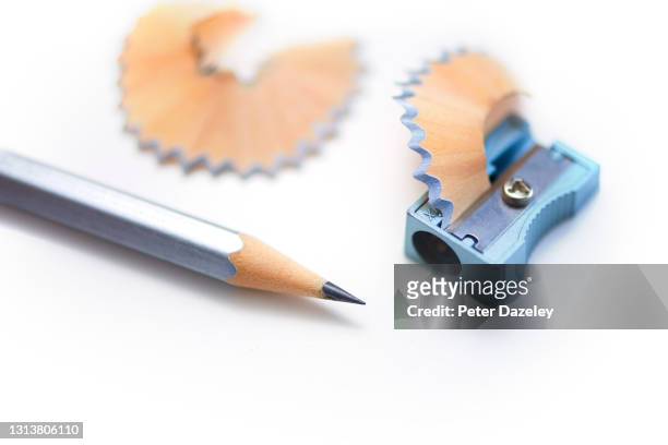 pencil and sharpener with shavings - pencil shavings stock pictures, royalty-free photos & images