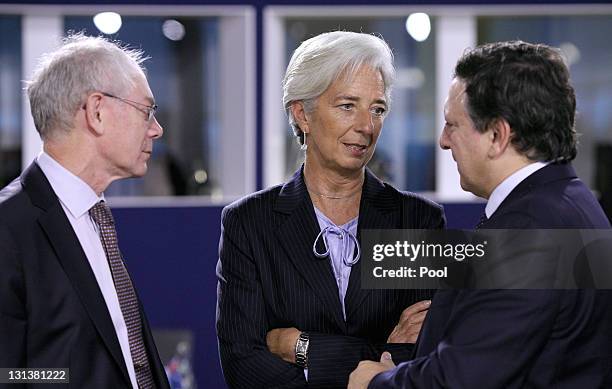 Herman Van Rompuy, president of the European Council listens as Christine Lagarde, managing director of the International Monetary Fund speaks with...