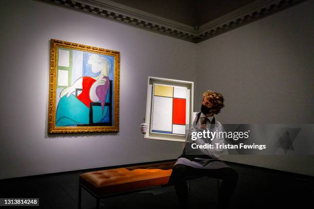 Pablo Picasso's Femme assise pres d'une fenetre est. $55 million and Piet Mondrian's Composition: No. II, with Yellow, Red and Blue, est. $25...